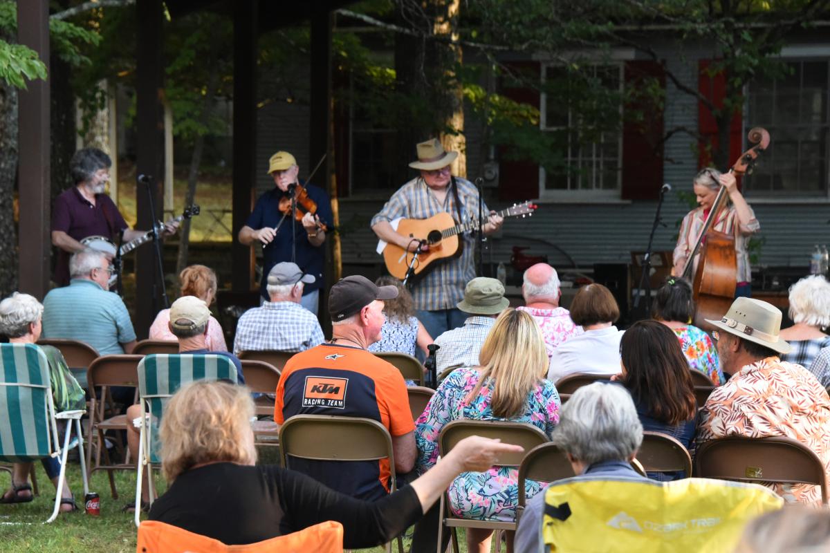 Musicians playing outside under the Pavilion 